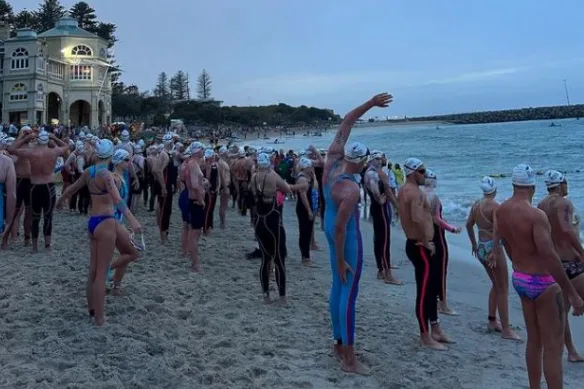 compititors standing at start line at Cottesloe beach